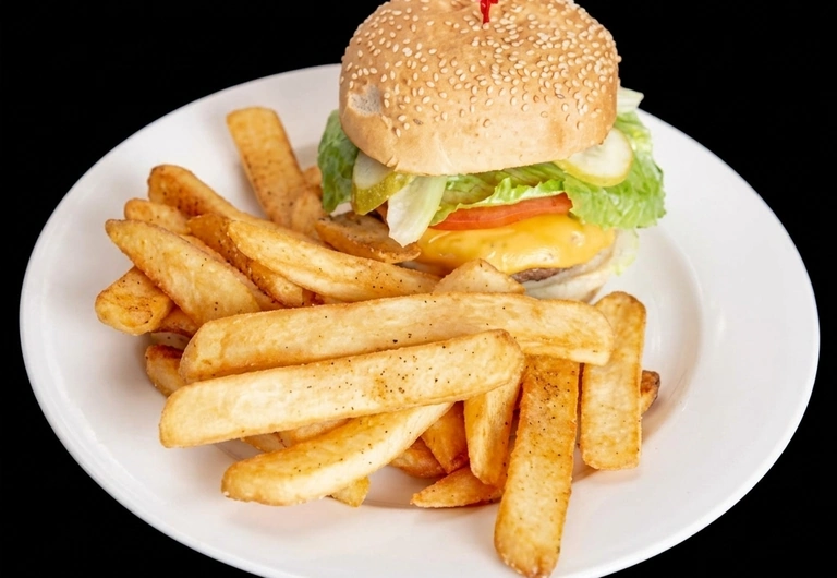 Bacon cheeseburger with fries, gravy and chicken wings at Capital Pizza & Steak House Belle Rive Edmonton