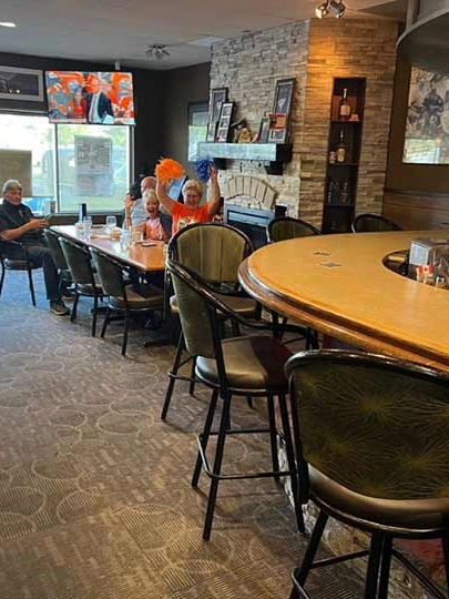 Family dining area with tables and booths at Capital Pizza & Steak House in Belle Rive, Edmonton